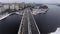 Aerial view flight of drone over clouds with tracking of moving cars on the high-speed highway in Moscow