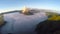 Aerial view flight over Mount Bromo volcano during sunrise.