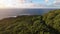 Aerial view flight over mountains and oceans to meet the setting sun Azores