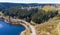 Aerial view of a flight over a reservoir in the Harz Mountains, a German low mountain range, with mountains and forests