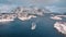 Aerial view of floating fishing boat, blue sea and snowy islands