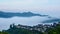 Aerial view of floating sea of clouds like cloud waves in mountains in early morning