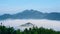 Aerial view of floating sea of clouds like cloud waves in mountains in early morning, Anhui, China