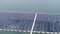 Aerial view of floating solar panels at sustainable electrical power plant for producing clean electric energy. Concept