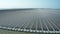 Aerial view of Floating solar power plant and  wind turbine farm