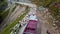 Aerial view of flock of sheeps passing roads for grazing and blocking highway in manali , himachal pradesh