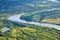 Aerial view on the flood land the great river during summer.