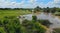 Aerial view flooded forest plains with country road