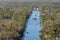 Aerial view of flooded street after hurricane rainfall with driving cars in Florida residential area. Consequences of