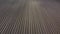 aerial view flying across a rural ploughed field in the English countryside