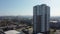 Aerial view, flying around a newly built high-rise building