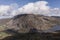 Aerial view of flying drone Epic Autumn Fall landscape image of view along Ogwen vslley in Snowdonia National Park with moody sky