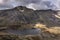 Aerial view of flying drone Epic dramatic Autumn landscape image of Llyn Idwal in Devil`s Kitchen in Snowdonia National Park with