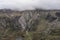 Aerial view of flying drone Epic dramatic Autumn landscape image of Llyn Idwal in Devil`s Kitchen in Snowdonia National Park with