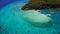 Aerial view flying over amazing of sandy beach clear sea water of the Sumilon island beach landing near Oslob, Cebu, Philippines.