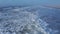 Aerial view flying over the shore line at the beach.