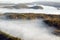 Aerial view of fog in autumn over islands and hills north of Portland Maine