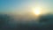 Aerial view of fog in spring. Sunrise above the clouds.