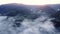 Aerial view, foggy morning mountain forest landscape with golden clouds, sunrise, misty landscape