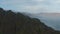 Aerial view of foggy panorama of misty overcast highlands in Iceland. Drone view of rocky mountains ridge in southern