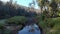 Aerial view of following river through pine forest Balingup Western Australia