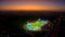Aerial view on football stadium illuminated by jupiter on evening