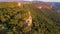 Aerial view of forest gorwing right to the edge of a sheer cliff.