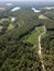 Aerial view of forest, gravel road and many small lakes