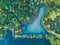 Aerial view of a forest lake. Aerial view of blue lake and green forests on a sunny summer day. Drone photography
