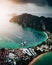 Aerial view of a forested green rocky island with a sandy beach in Thailand, Krabi, Phi Phi Island