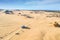 Aerial view of Four-wheel-drive car on Pinnacles Drive, dirt road in Pinnacles Desert, Nambung National Park, Western Australia.,