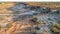 Aerial view of four wheel drive vehicle and large caravan camped just after sunrise in the outback of Australia