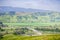 Aerial view of freeway junction and agricultural fields, mountain background, south San Francisco bay, San Jose, California