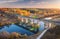 Aerial view of freight train on railroad bridge and river