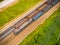 Aerial view of freight train wagons on large railway track field. Concept of modern logistics. Coal delivery