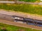 Aerial view of freight train wagons on large railway track field. Concept of modern logistics. Coal delivery