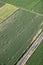 An aerial view of  freshly baled hay in the field.