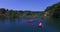 Aerial view of friends paddling canoe on river