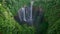 Aerial view frying to Tumpak Sewu waterfall, falls flow into steep canyon, East Java, Indonesia