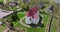 aerial view and full flyby over old baroque temple or catholic church in countryside