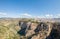 Aerial view at the full Ronda city, iconic New Bridge above the gauge, natural geological phenomenon, erosion cliffs, touristic