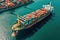 Aerial view of fully loaded container ship against the background of a cargo terminal in a seaport, port cranes, stacks