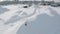 Aerial view of a funny playful dog with grey fur barks and wags big long fuzzy tail on white snow. Clip. A dog