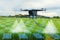 Aerial view futuristic agricultural drone,spraying chemicals or organic fertilizers into water droplets in agricultural areas