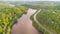 Aerial View of the Gatineau River near the village Wakefield, Canada. Clouds reflecting in the river water, a street with cars