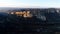 Aerial view of a giant beautiful cliff under sunset light. Shot. Natural landscape of a breathtaking rock with flat top