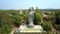 Aerial view giant Buddha statue among tropical park