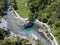 Aerial view of the giant rock called the Bidet della Contessa in the Val di Mello, a green valley. Sondrio. Italy