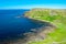 Aerial view of Giants Causeway most popular and famous landmark in Northern Ireland. Coast of Atlantic ocean and calm water