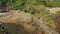 Aerial view of girl walking towards Pura Batu Bolong temple in Lombok, Indonesia